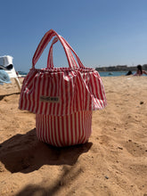 Load image into Gallery viewer, Red and white striped bag stroller basket on a sandy beach