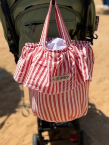Load image into Gallery viewer, Red and white striped stroller basket bag with 'Little World' label attached to a stroller
